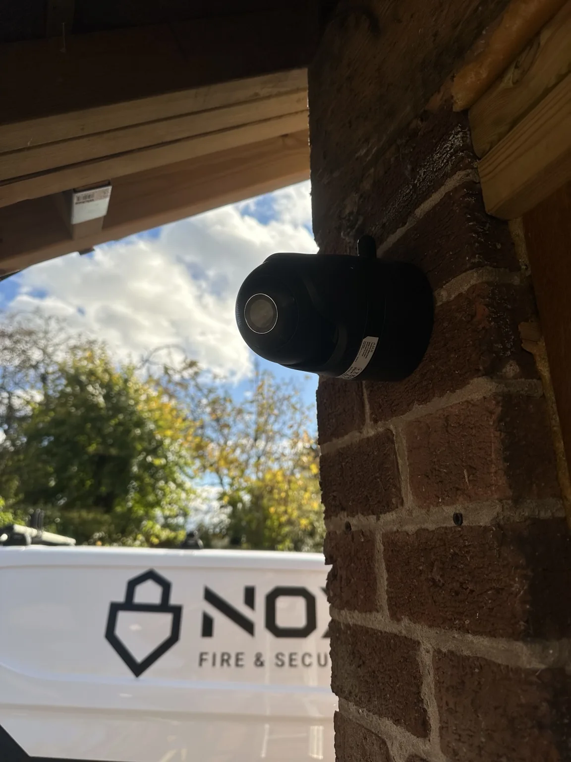 Black Ajax CCTV camera mounted on the brickwork of the Chesterfield bungalow