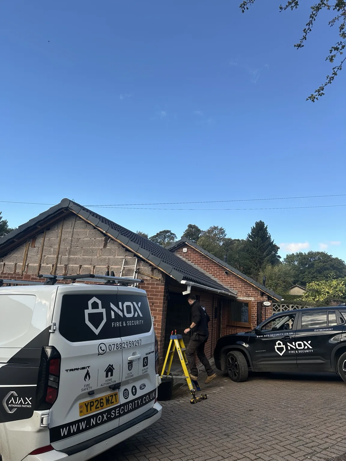 NOX vans outside a bungalow undergoing renovation in Chesterfield