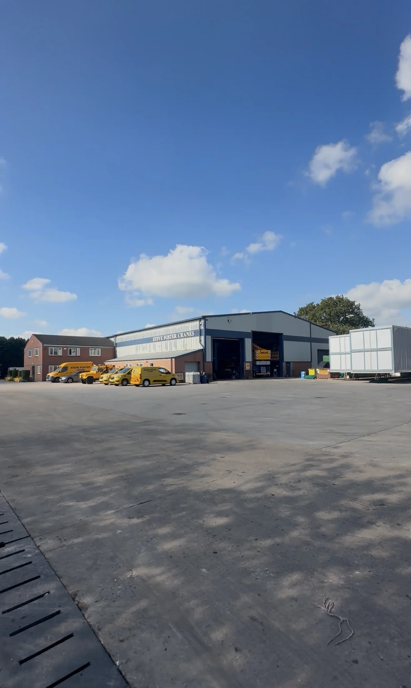 Wide view of the Steve Foster Cranes industrial yard in Derby