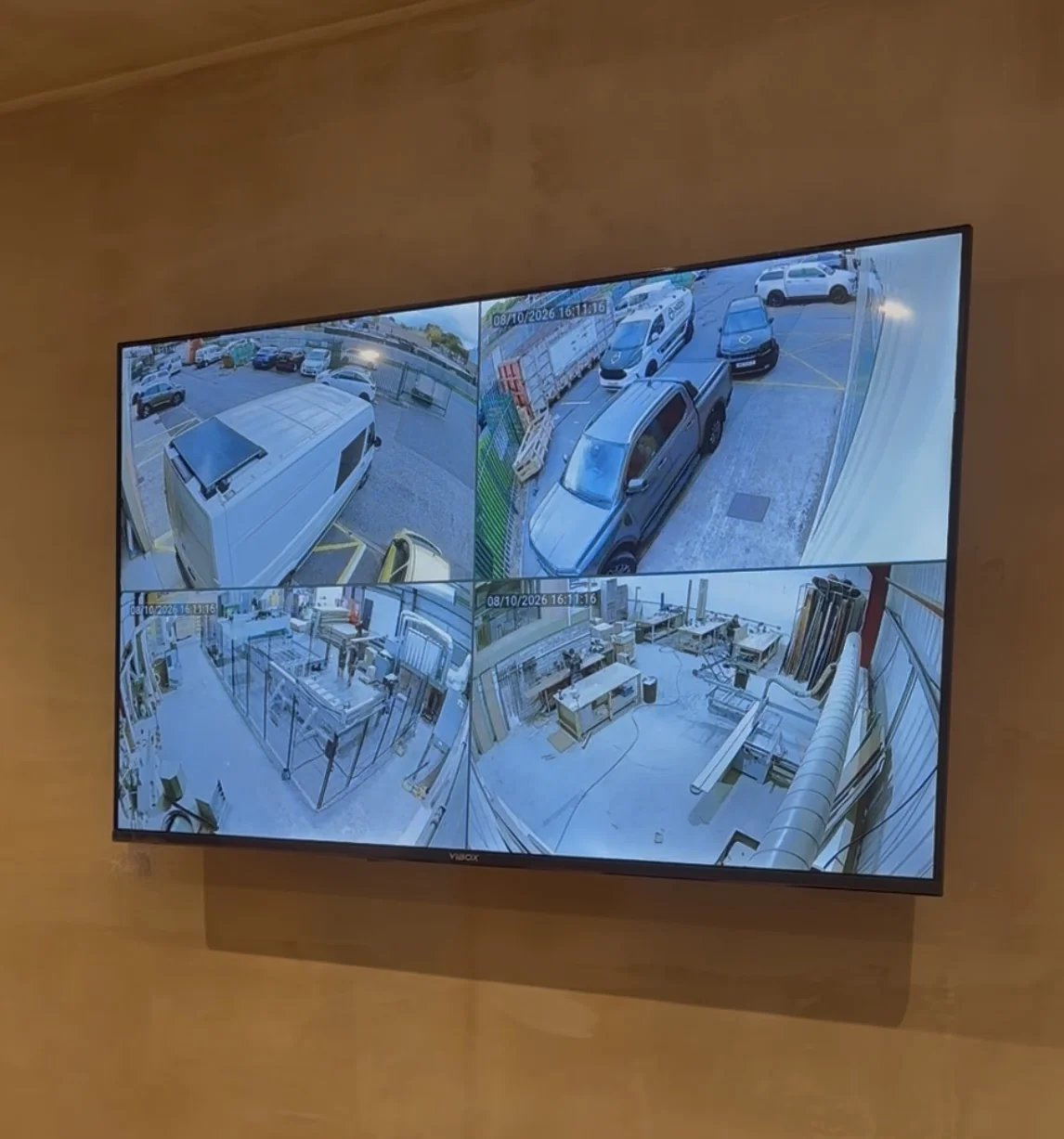 CCTV camera feeds displayed on a wall-mounted screen