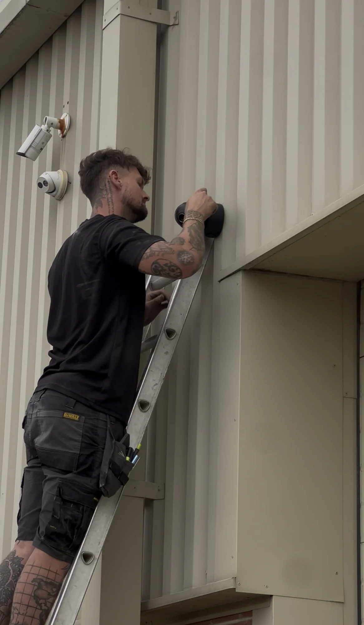 NOX engineer installing CCTV at David Malin Kitchens