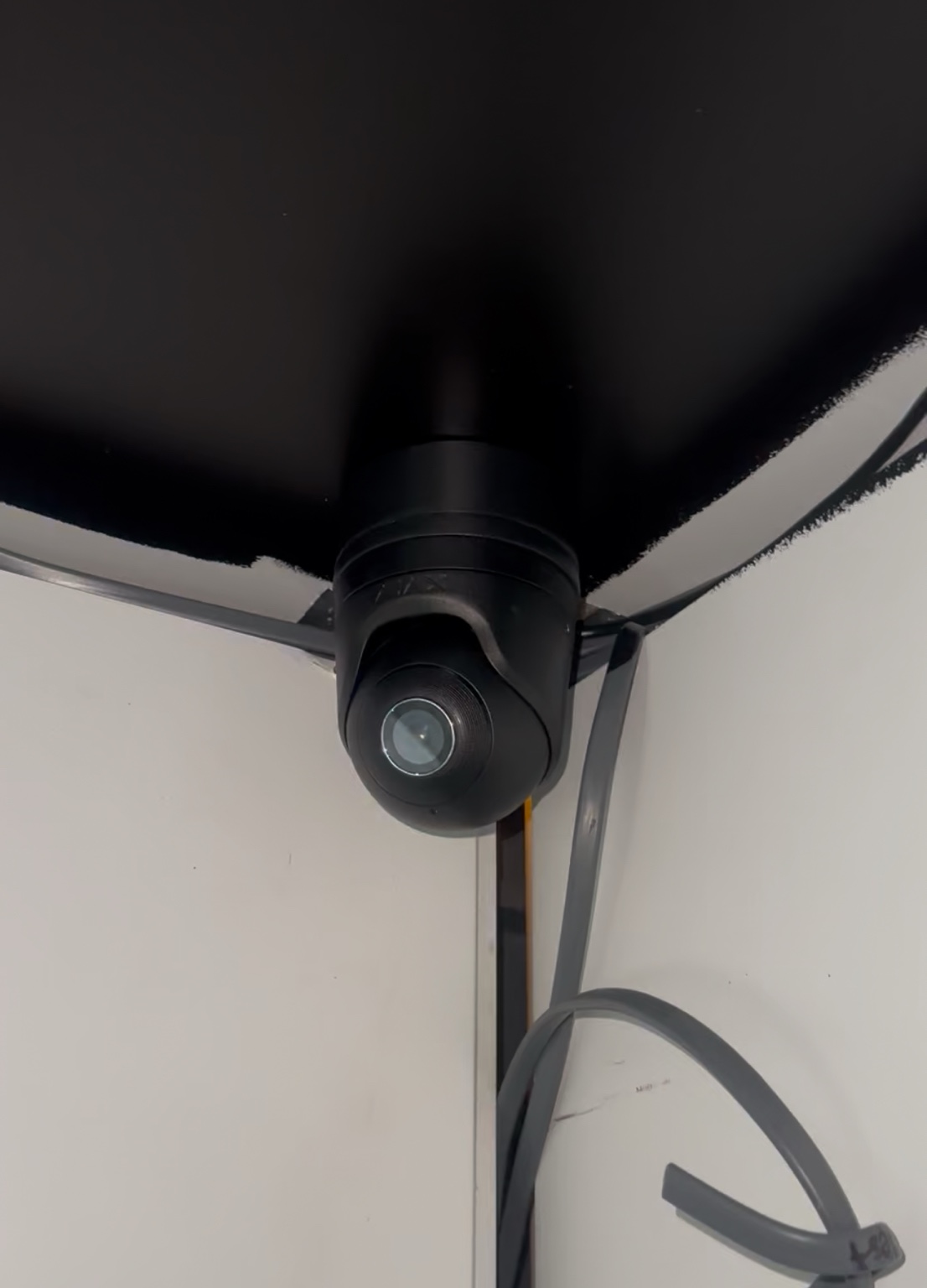 Black CCTV camera installed inside The Tan Station